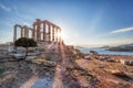 Cape Sounion with ruins of an ancient Greek temple of Poseidon during of sunset over sea in Greece Royalty Free Stock Photo