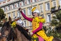 Famous Carnival of Nice, Flowers` battle. An english rider with the yellow costume greets the audience