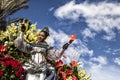 Famous Carnival of Nice, Flowers` battle. A woman entertainer with red flowers