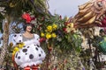 Famous Carnival of Nice, Flowers` battle. A woman in white costume and yellow flowers