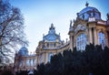 Statue of a lion at entrance and stone gate at entrance to to Vajdahunyad Castle in City Park of Budapest, Hungary. Royalty Free Stock Photo