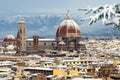 The famous Cathedral of Santa Maria del Fiore in Florence with the Dome covered with snow in december. View from Piazzale Royalty Free Stock Photo