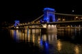 The famous Chain bridge with the illuminated city in the background at night, Budapest, Hungary Royalty Free Stock Photo