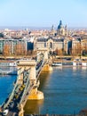 Famous Chain Bridge over Danube River, Gresham Palace and Saint Stephen`s Basilica in Budapest, Hungary Royalty Free Stock Photo