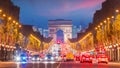Famous Champs-Elysees and Arc de Triomphe at twilight in Paris Royalty Free Stock Photo