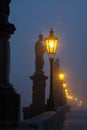 On the famous Charles Bridge in the morning mist Royalty Free Stock Photo