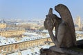 Famous chimera of Notre-Dame overlooking Paris. Royalty Free Stock Photo