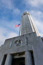 Famous Coit Tower with US Flag in San Francisco Telegraph Hill, California, USA Royalty Free Stock Photo