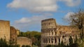 The famous of the Coliseum or Flavian Amphitheatre (Amphitheatrum Flavium or Colosseo) blue sky scene at Rome Royalty Free Stock Photo