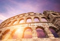 Famous Croatian city Pula old amphitheater arches with sunset sk