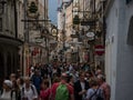 Famous crowded pedestrian zone shopping street Getreidegasse in historic old town of Salzburg city Austria alps Europe