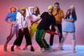 Famous dancers posing on pink background