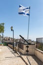 The famous Davidka - grenade launcher released by handicraft during the Independence War of Israel and the flag of Israel in the c Royalty Free Stock Photo