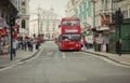 Famous double decker bus, symbol of London, on a street in London