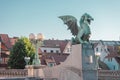 Famous dragon bridge or zmajski most, a landmark in ljublana, slovenia in early morning hours. Nobody around. Detail of dragon and Royalty Free Stock Photo