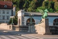 Famous dragon bridge or zmajski most, a landmark in ljublana, slovenia in early morning hours. Nobody around. Detail of dragon and Royalty Free Stock Photo