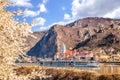 Durnstein village during spring time with tourist ship on Danube river in Wachau, Austria Royalty Free Stock Photo