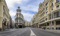 Famous Edificio Grassy building with the Rolex sign and beautiful buildings on Gran Via shopping street in Madrid, Spain