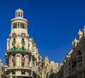 Famous Edificio Grassy building with the Rolex sign and beautiful buildings on Gran Via shopping street in Madrid, Spain Royalty Free Stock Photo