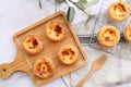 Egg tart, Portugal egg tart served Egg tart served the wooden tray and cooling rack of marble table - Flat lay food