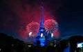 Famous Eiffel Tower and beautiful fireworks during celebrations of French national holiday - Bastille Day. Royalty Free Stock Photo