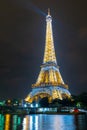 Famous Eiffel tower and Seine river with colorful reflections at night, Paris, France Royalty Free Stock Photo