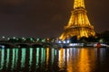 Famous Eiffel tower and Seine river with colorful reflections at night, Paris, France Royalty Free Stock Photo