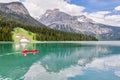 Emerald Lake, Yoho National Park, British Columbia, Canada. Turquoise water and green trees. Red canoe on the lake Royalty Free Stock Photo