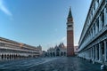 Famous empty San Marco square with Basilica of Saint Mark and Bell Tower at sunrise,Venice,Italy.Early morning at popular tourist Royalty Free Stock Photo