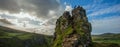 Lonely people, dog, grassland, mountain landscape on top overlook, Fairy Glen, Skye,Scotland, UK.