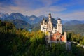 Famous fairy tale Neuschwanstein Castle in Bavaria, Germany, late afternoon with blue sky with white clouds Royalty Free Stock Photo