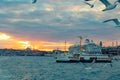 Famous ferries of Istanbul and seagulls at sunset with cruise ship Royalty Free Stock Photo