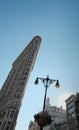 Famous Flatiron building seen on 5th avenue, Manhattan, USA.