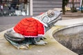 Famous frog in lÃâ¢bork poland in a hand-knitted red cape for Christmas close-up