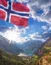 Famous Geiranger fjord with flag of Norway Royalty Free Stock Photo