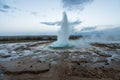 The famous geysir/Strokur with explosion, in Haukadalur valley near Reykjavik in Iceland during blue hour with no people around. Royalty Free Stock Photo