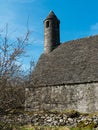 The famous Glendalough Monastic site with its round tower and cemetery in the Wicklow mountains in County Wicklow, Royalty Free Stock Photo