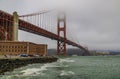 Golden Gate bridge with low fog rolling in San Francisco, California Royalty Free Stock Photo