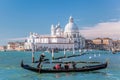 Grand Canal with gondola against Basilica Santa Maria della Salute in Venice, Italy Royalty Free Stock Photo