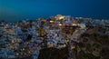 The Famous greek iconic  tourist destination Oia village  in the night with traditional white houses and windmills in Santorini Royalty Free Stock Photo