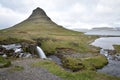 Famous kirkjufell mountain with the kirkjufell falls waterfalls in front in Iceland