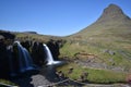 Famous kirkjufell mountain with the kirkjufell falls waterfalls in front in GrundarfjÃÂ¶dur in Iceland