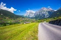 Famous Grindelwald valley, green forest, Alps chalets and Swiss Alps, Switzerland Royalty Free Stock Photo