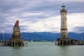 The famous harbor entrance of Lindau Bavarian Lion and New Lighthouse on Bodensee lake view Royalty Free Stock Photo