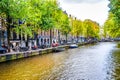 The famous Herengracht Gentlemen`s Canal with its large historic houses and the many bikes in the city center of Amsterdam