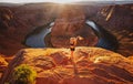 Famous hiking place. Grand canyon, Glen Canyon, Arizona. Travel and adventure concept. Young woman looking to Horseshoe Royalty Free Stock Photo