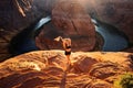 Famous hiking place. Grand canyon, Glen Canyon, Arizona. Travel and adventure concept. Young woman looking to Horseshoe Royalty Free Stock Photo