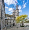 Famous historic church in Zurich on a spring day with flags at attention in a brisk wind