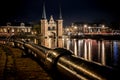 The famous historical `Waterpoort` in the city of Sneek at night with reflections in the canal - Sneek, Friesland, The Netherlan