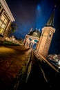 The famous historical `Waterpoort` in the city of Sneek at night with reflections in the canal - Sneek, Friesland, The Netherlan